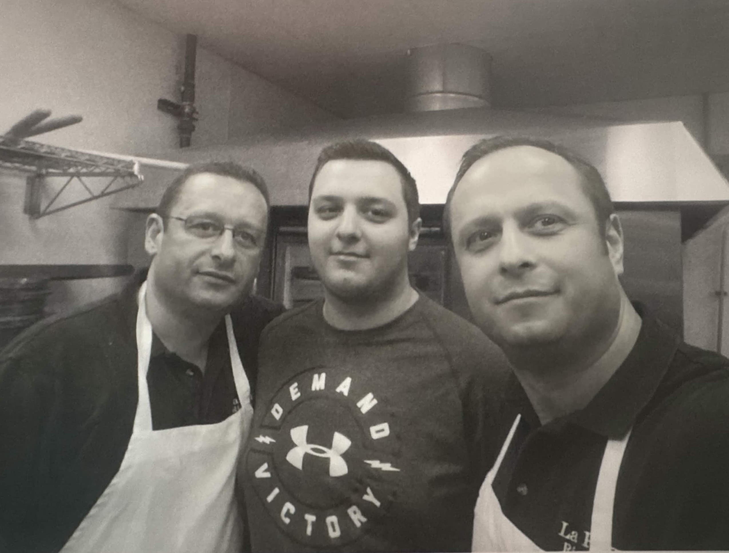 Three men in the Maria's pizza kitchen.